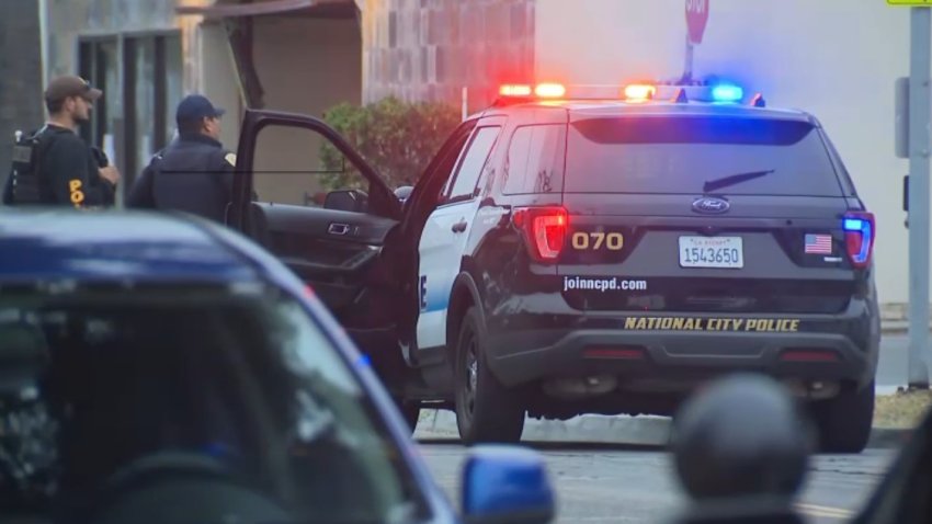 Image taken Tuesday morning in National City showing authorities serving search warrants as part of a human-trafficking and prostitution investigation.